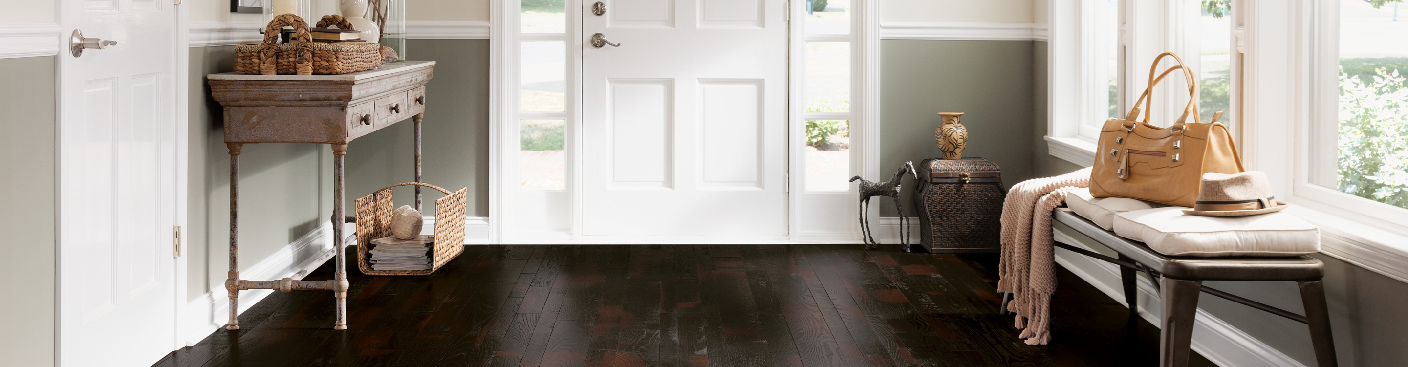 dark wood flooring in entryway front door